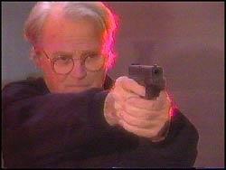 Parker shown drawing his weapon